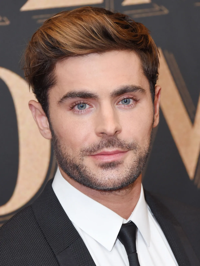alt="Zac Efron mit Freundin auf rotem Teppich"